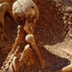 Children discover mysterious ancient skeleton sitting upright next to playground in France