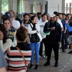 As undocumented migrants line up for Spain’s amnesty program, political opponents vow a fight