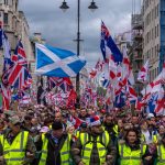 Thousands hit London streets for “Unite the Kingdom” march organized by far-right activist Tommy Robinson