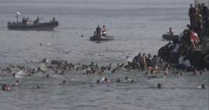 cbsn-fusion-thousands-of-migrants-cross-into-spains-tiny-ceuta-territory-some-die-in-journey-thumbna.jpeg