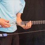Burls Art Built a Playable Guitar With No Neck or Body Using Aircraft Cable and a Bed Frame